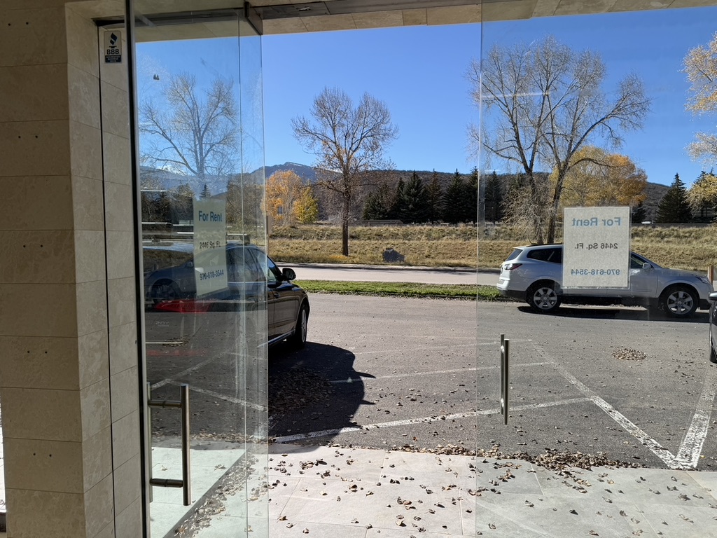 Glass entry and parking frontage